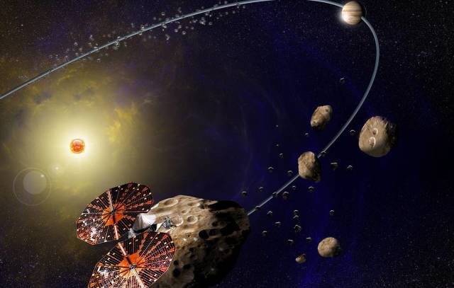 Иллюстрация космического корабля Люси, пролетающего мимо троянского астероида Эврибат